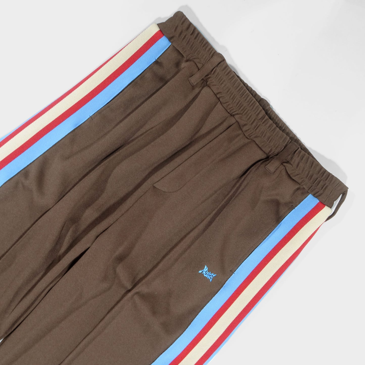 MUZE TURQUOISE LABEL - TRACK JERSEY PANTS(BROWN×RED LINE) ミューズ 2023年春夏 ジャージスラックス ブラウン